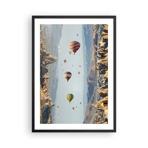 Plakát v černém rámu - Horkovzdušné balóny vznášející se nad skalnatým terénem - 50x70cm - Zde je možné vše - Moderní nástěnná dekorace do obývacího pokoje a ložnice ARTTOR