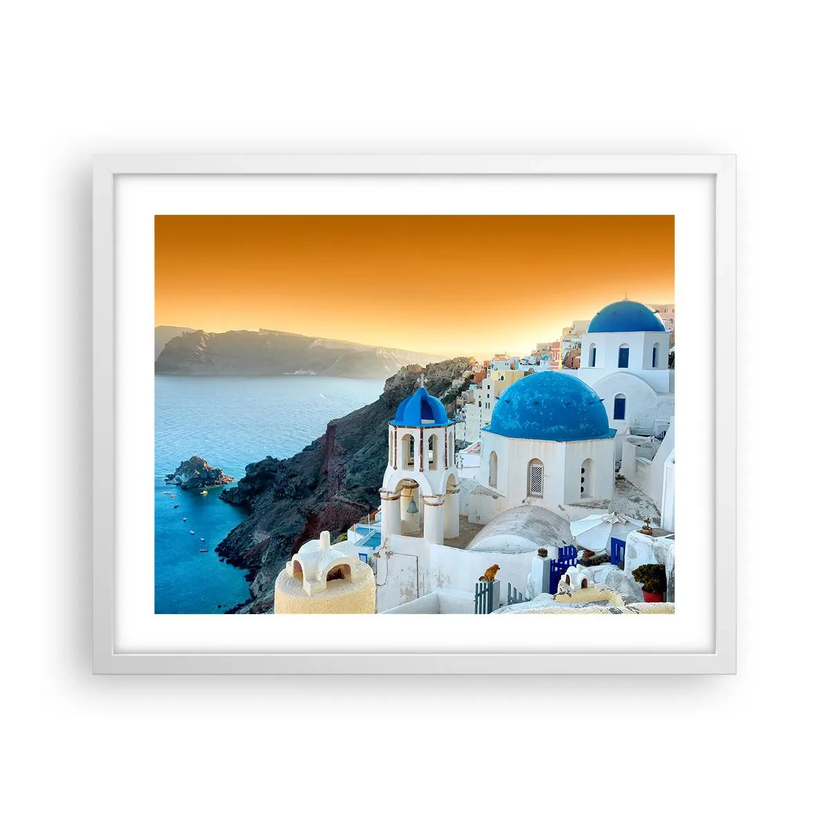Plakát v bílém rámu - Santorini - přitulené ke skalám - 50x40 cm