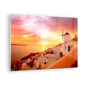 Obraz na skle - Západ slunce nad Santorini s bílými budovami a větrným mlýnem - 70x50cm - Rozplynout se v bílé a zlaté - Moderní nástěnná dekorace do obývacího pokoje a ložnice ARTTOR