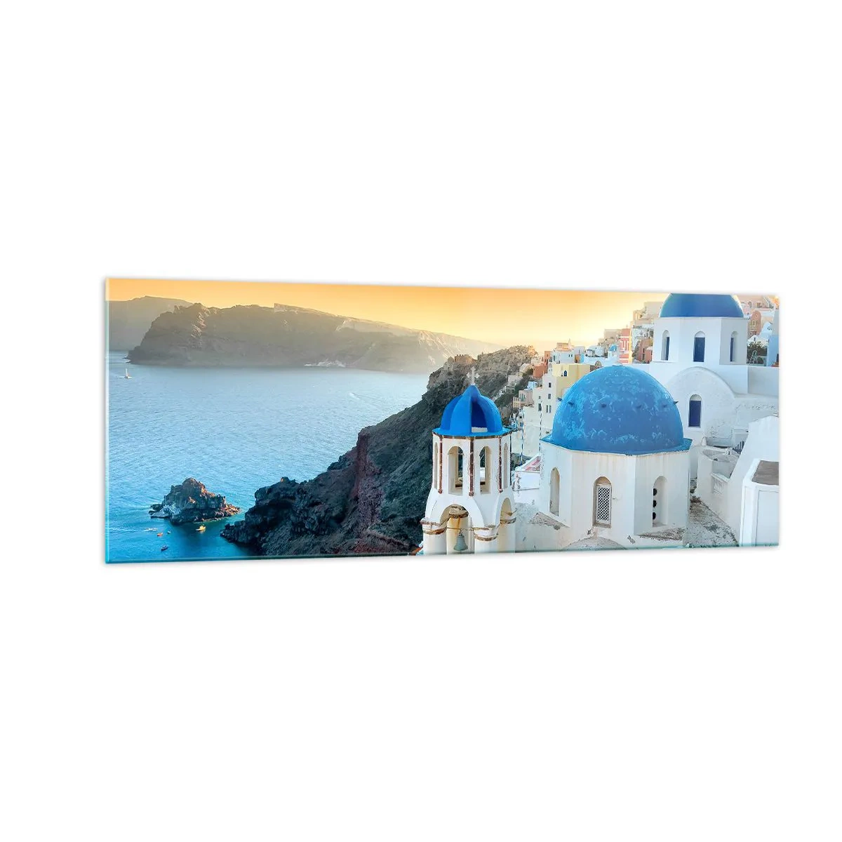 Obraz na skle - Santorini - přitulené ke skalám - 140x50 cm