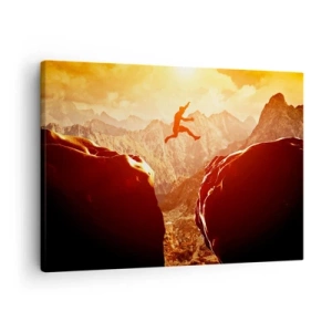 Obraz na plátně - Postava skákající mezi skalami s horami v pozadí - 70x50cm - Překročením hranic - Moderní nástěnná dekorace do obývacího pokoje a ložnice ARTTOR