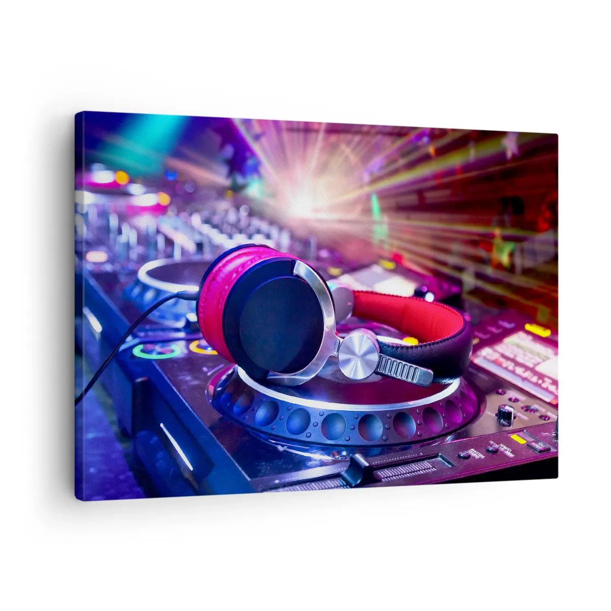 Obraz na plátně - DJ sluchátka na konzoli osvětlená reflektory na večírku - 70x50cm - Bude, bude se dít - Moderní nástěnná dekorace do obývacího pokoje a ložnice ARTTOR