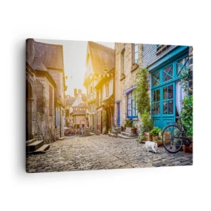 Obraz na plátně - Okouzlující ulice s kamennou dlažbou na slunci - 70x50cm - Bílý duch městečka - Moderní nástěnná dekorace do obývacího pokoje a ložnice ARTTOR