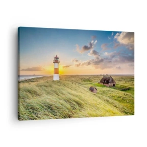 Obraz na plátně - Maják s loukami a domy zalitými sluncem v pozadí - 70x50cm - Mezi vlnami - Moderní nástěnná dekorace do obývacího pokoje a ložnice ARTTOR