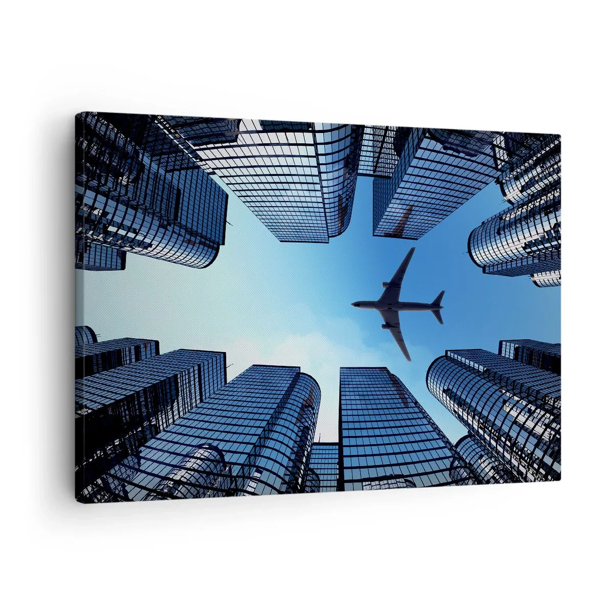 Obraz na plátně - Letadlo letící nad moderními mrakodrapy v centru města. - 70x50cm - Pohled ze skleněné rokle - Moderní nástěnná dekorace do obývacího pokoje a ložnice ARTTOR