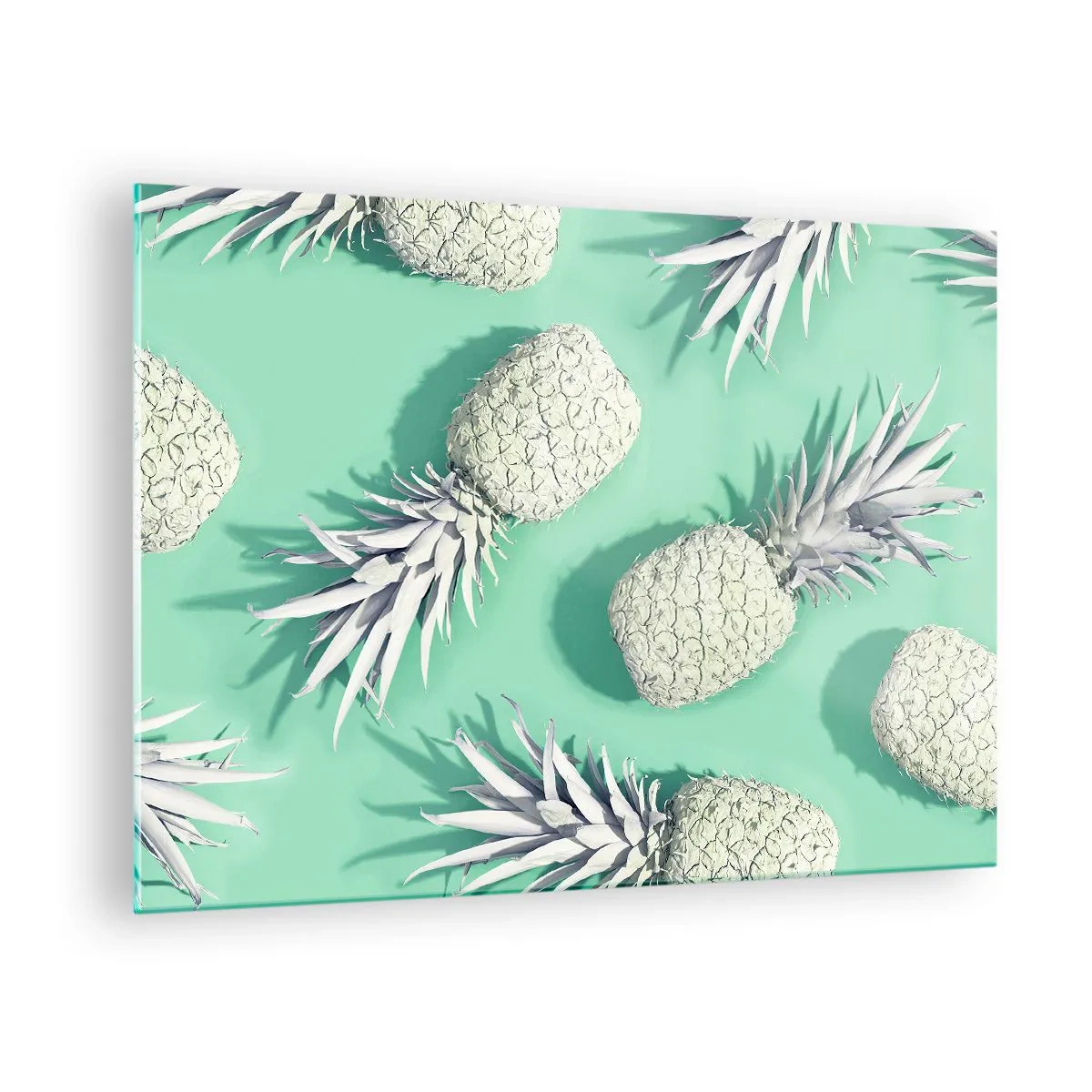 Obraz na skle - Bílé ananasy na mátovém pozadí v umělecké kompozici - 70x50cm - skvěle ladí s mátou - Moderní nástěnná dekorace do obývacího pokoje a ložnice ARTTOR