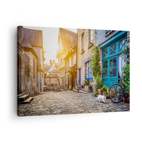 Obraz na plátně - Okouzlující ulice s kamennou dlažbou na slunci - 70x50cm - Bílý duch městečka - Moderní nástěnná dekorace do obývacího pokoje a ložnice ARTTOR