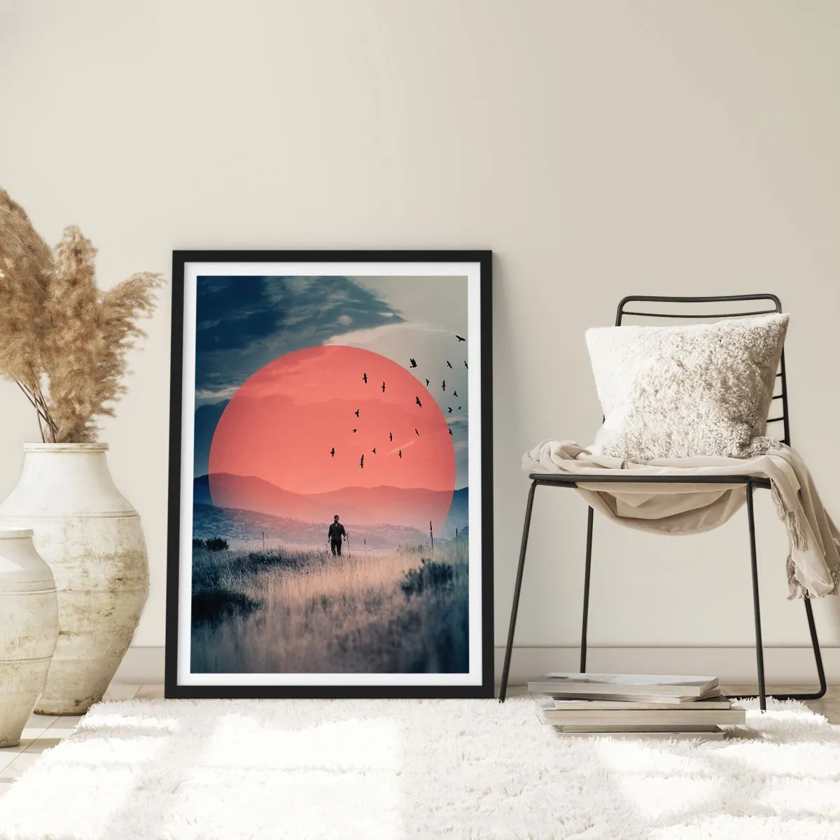 Plakát v černém rámu - Muž procházející se polem proti rudému slunci - 50x70cm - Ve svém živlu - Moderní nástěnná dekorace do obývacího pokoje a ložnice ARTTOR