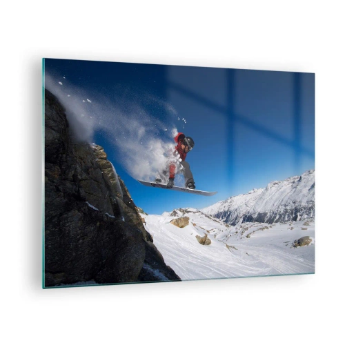 Obraz na skle - Snowboardista skáče na pozadí hor - 70x50cm - A stal ses součástí prostoru - Moderní nástěnná dekorace do obývacího pokoje a ložnice ARTTOR